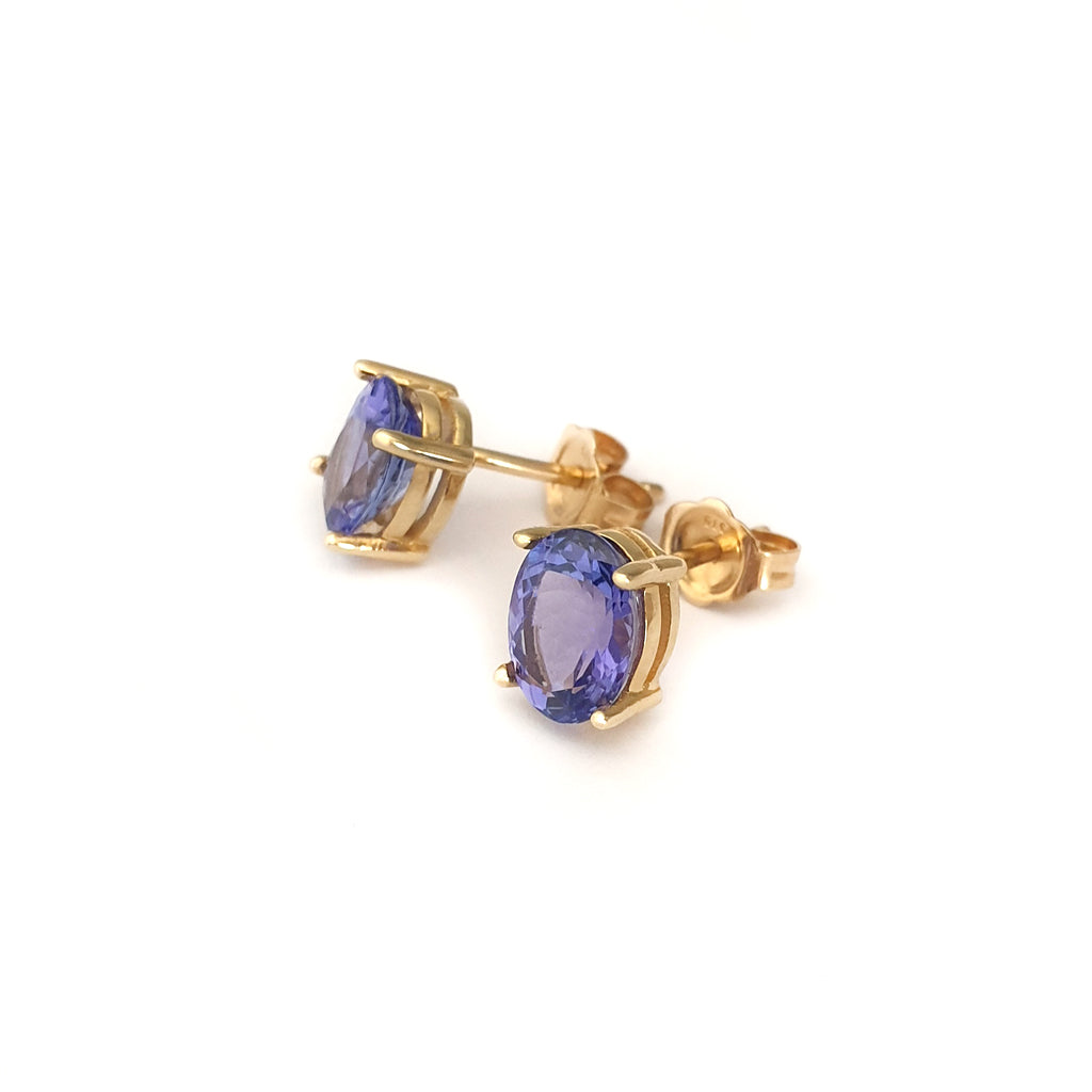 Classic Oval Cut Tanzanite Yellow Gold Four Claw Studs