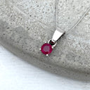 Petite Round Cut Ruby Four Claw Pendant