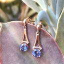 Round Cut Tanzanite and Rose Gold Drop Earrings with Diamond Crown Accent