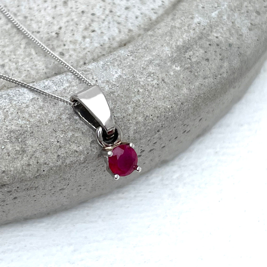 Petite Round Cut Ruby Four Claw Pendant