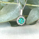 Classic Round Cut Emerald With Diamond Halo Pendant