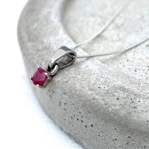 Petite Round Cut Ruby Four Claw Pendant