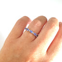 Half Eternity Oval Cut Tanzanite and Diamond Highlight Ring