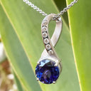 Luxurious Matt White Gold Bow Tanzanite and Diamonds Pendant