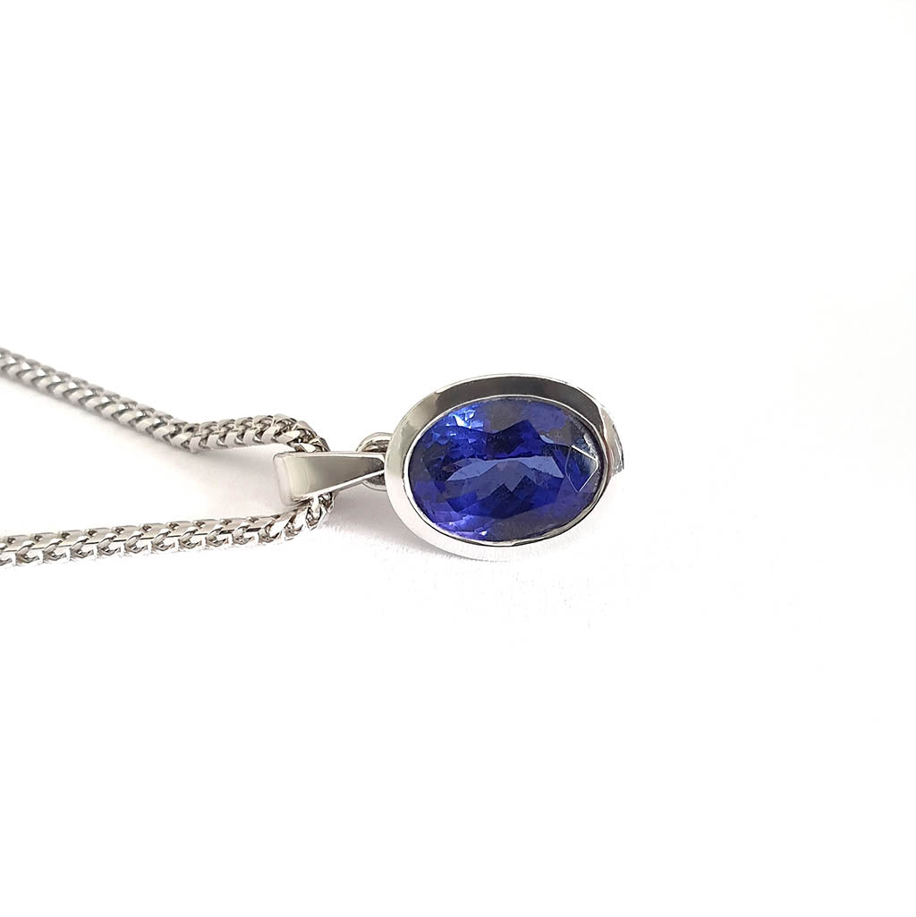 Luxurious Solid White Gold Bezel Set Oval Tanzanite Pendant