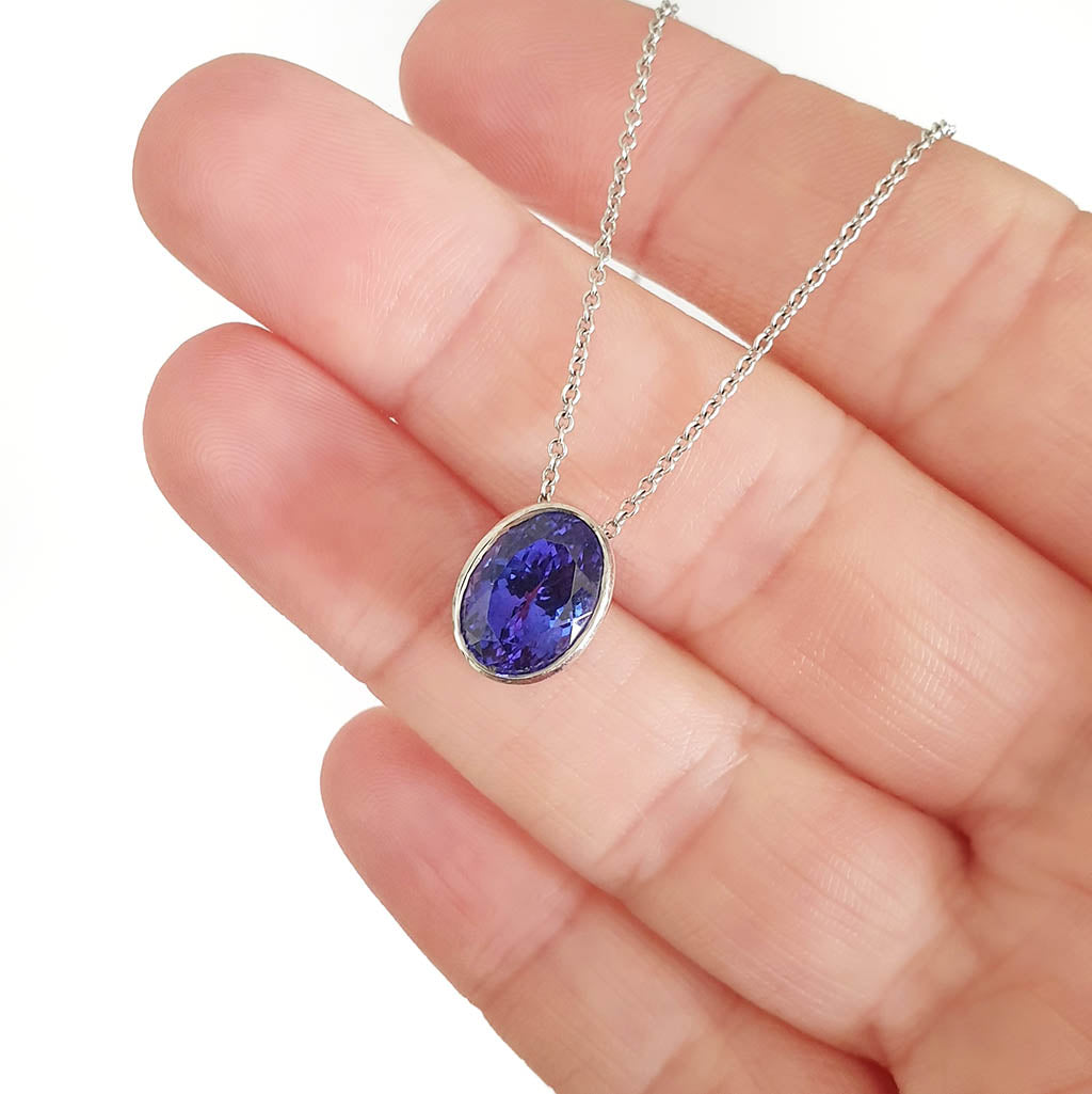 Luxuriously Suspended Slim Bezel Oval Tanzanite Pendant