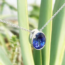 Luxuriously Suspended Slim Bezel Oval Tanzanite Pendant