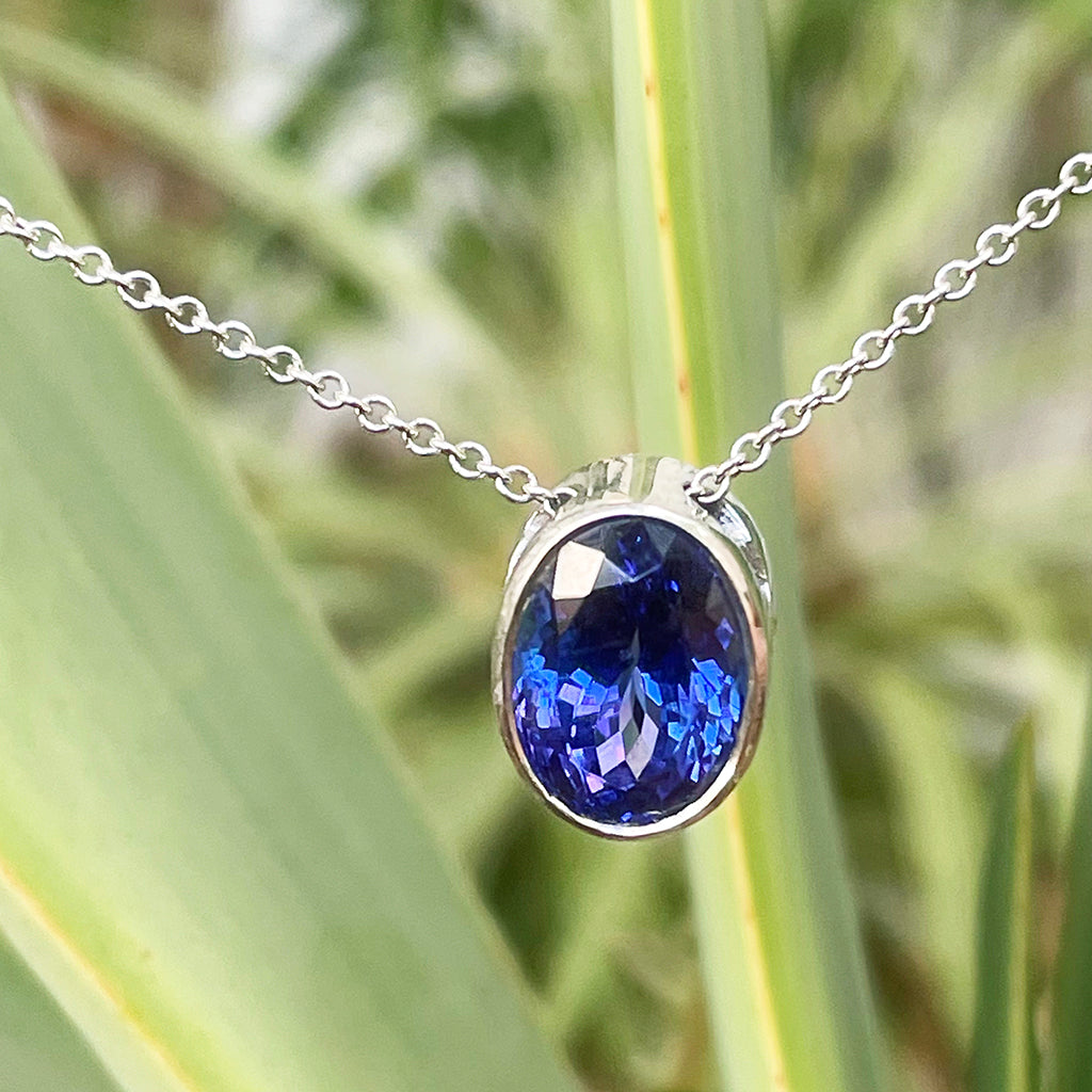 Luxuriously Suspended Slim Bezel Oval Tanzanite Pendant