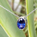 Luxuriously Suspended Slim Bezel Oval Tanzanite Pendant
