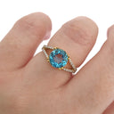 Majestic Round Cut Blue Topaz and Diamond Split Shank Ring
