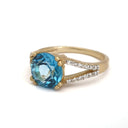 Majestic Round Cut Blue Topaz and Diamond Split Shank Ring