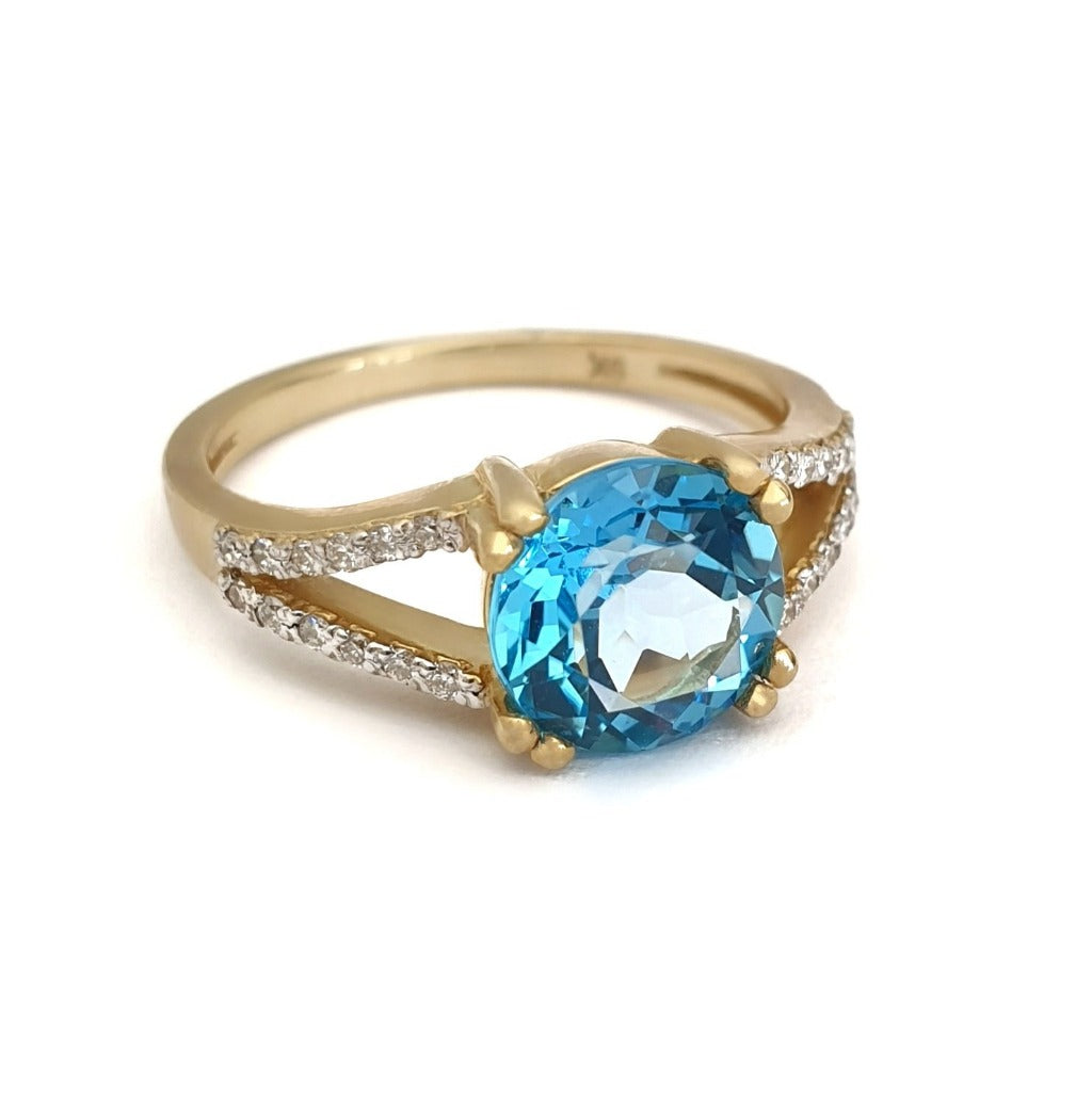 Majestic Round Cut Blue Topaz and Diamond Split Shank Ring