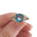 Majestic Round Cut Blue Topaz and Diamond Split Shank Ring