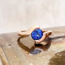 Molten Hot Round Cut Rose Gold Tanzanite Ring