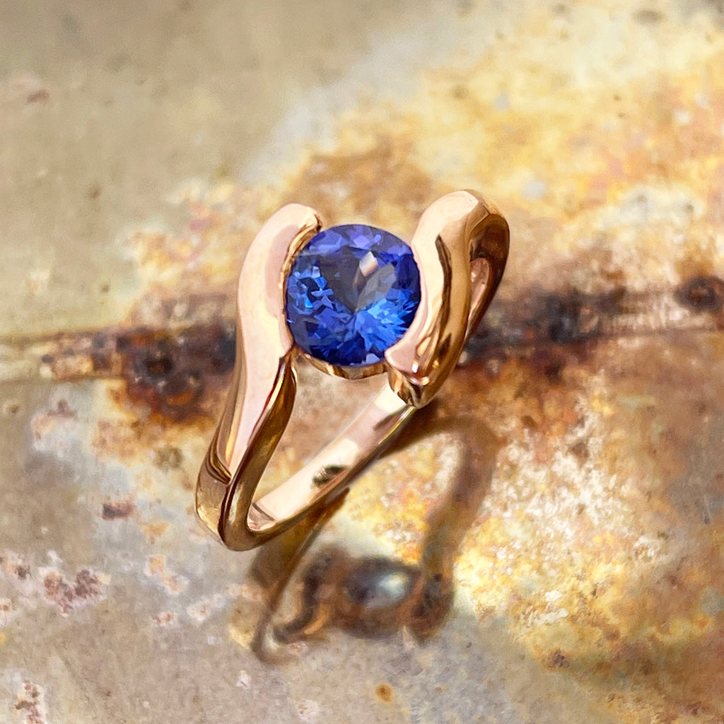 Molten Hot Round Cut Rose Gold Tanzanite Ring