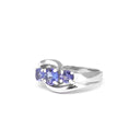 Ocean Wave Round Tanzanite Trilogy White Gold Ring