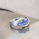Ocean Wave Round Tanzanite Trilogy White Gold Ring