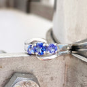 Ocean Wave Round Tanzanite Trilogy White Gold Ring