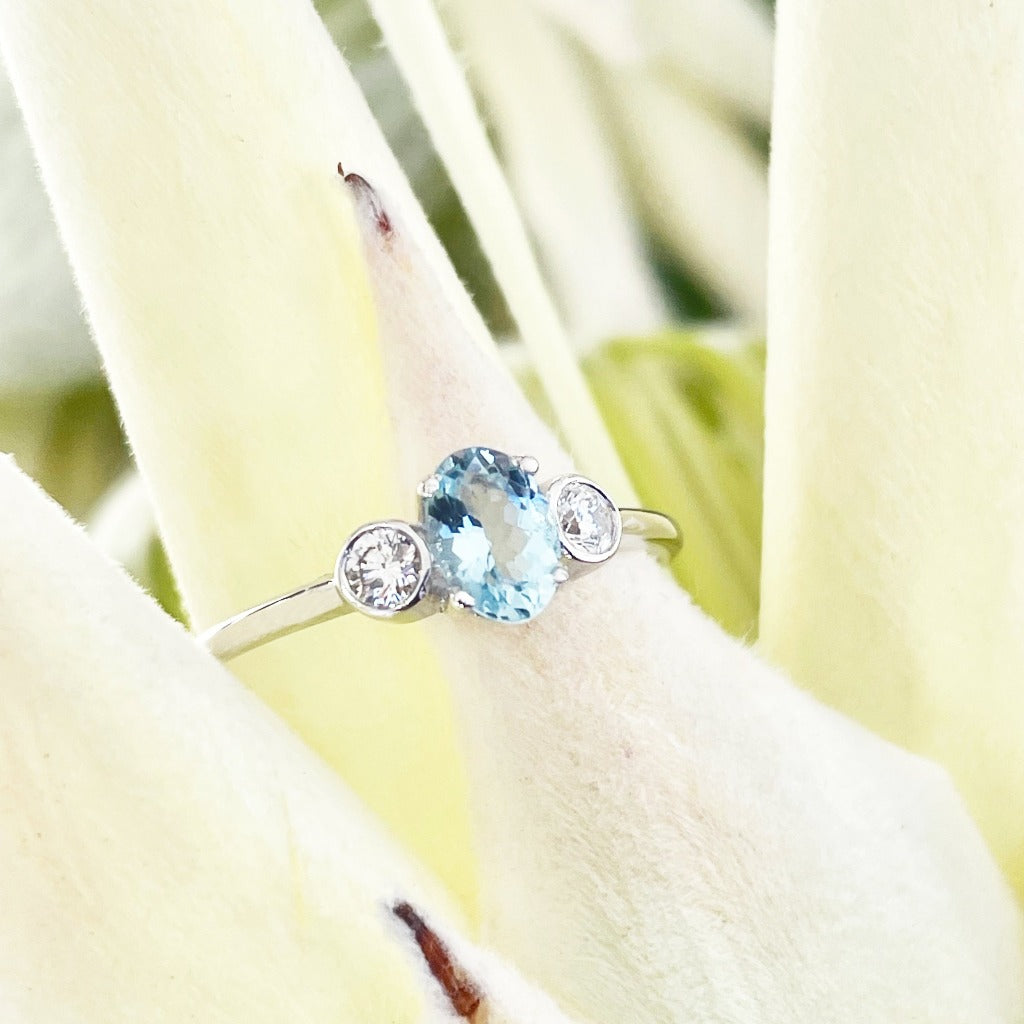 Oval Aquamarine and Double Bezel Diamond Highlight Ring