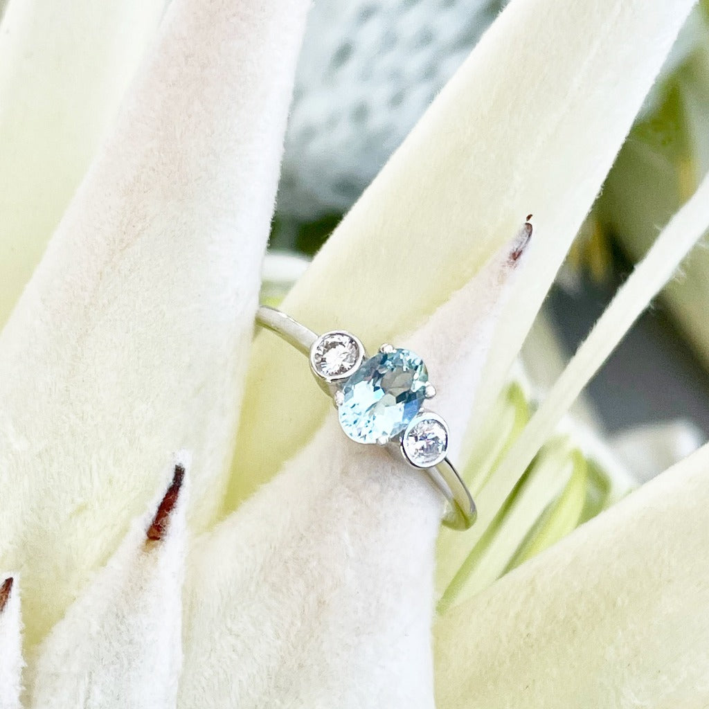 Oval Aquamarine and Double Bezel Diamond Highlight Ring