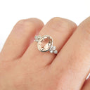  Oval Bezel Set Morganite Ring with Double Diamond Shoulder Trilogy Accents