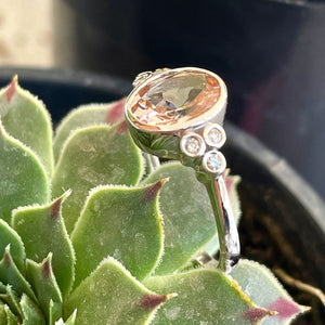 Oval Bezel Set Morganite Ring with Double Diamond Shoulder Trilogy Accents