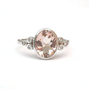  Oval Bezel Set Morganite Ring with Double Diamond Shoulder Trilogy Accents
