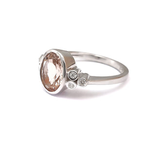 Oval Bezel Set Morganite Ring with Double Diamond Shoulder Trilogy Accents