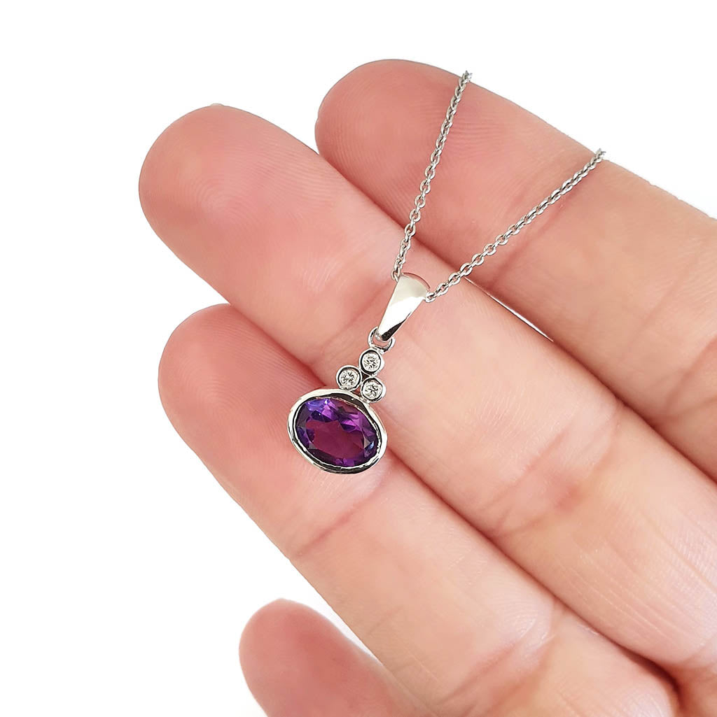 Oval Cut Amethyst with Trilogy Accent Pendant and Chain