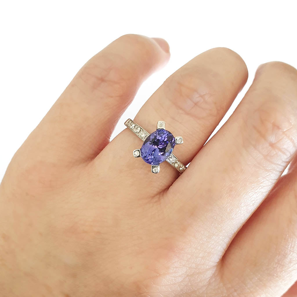 Oval Cut Solitaire Tanzanite Ring with Diamond Claw and Band Accents