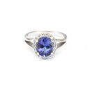 Oval Cut Tanzanite with Diamond Halo and Split Shoulder Ring