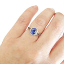 Oval Cut Tanzanite with Diamond Halo and Split Shoulder Ring