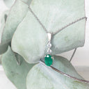 Oval Emerald and Double Diamond Pendant