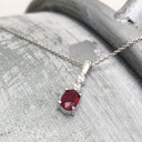 Oval Ruby and Double Diamond Pendant
