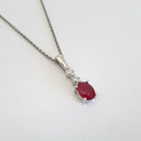 Oval Ruby and Double Diamond Pendant