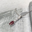 Oval Ruby and Double Diamond Pendant