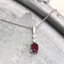 Oval Ruby and Double Diamond Pendant