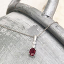 Oval Ruby and Double Diamond Pendant