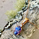 Oval Cut Tanzanite and Petite Diamond Highlight Pendant