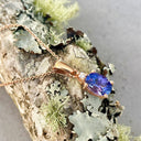 Oval Cut Tanzanite and Petite Diamond Highlight Pendant