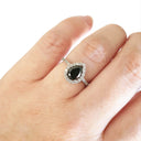 Pear Cut Black Diamond with White Diamond Halo