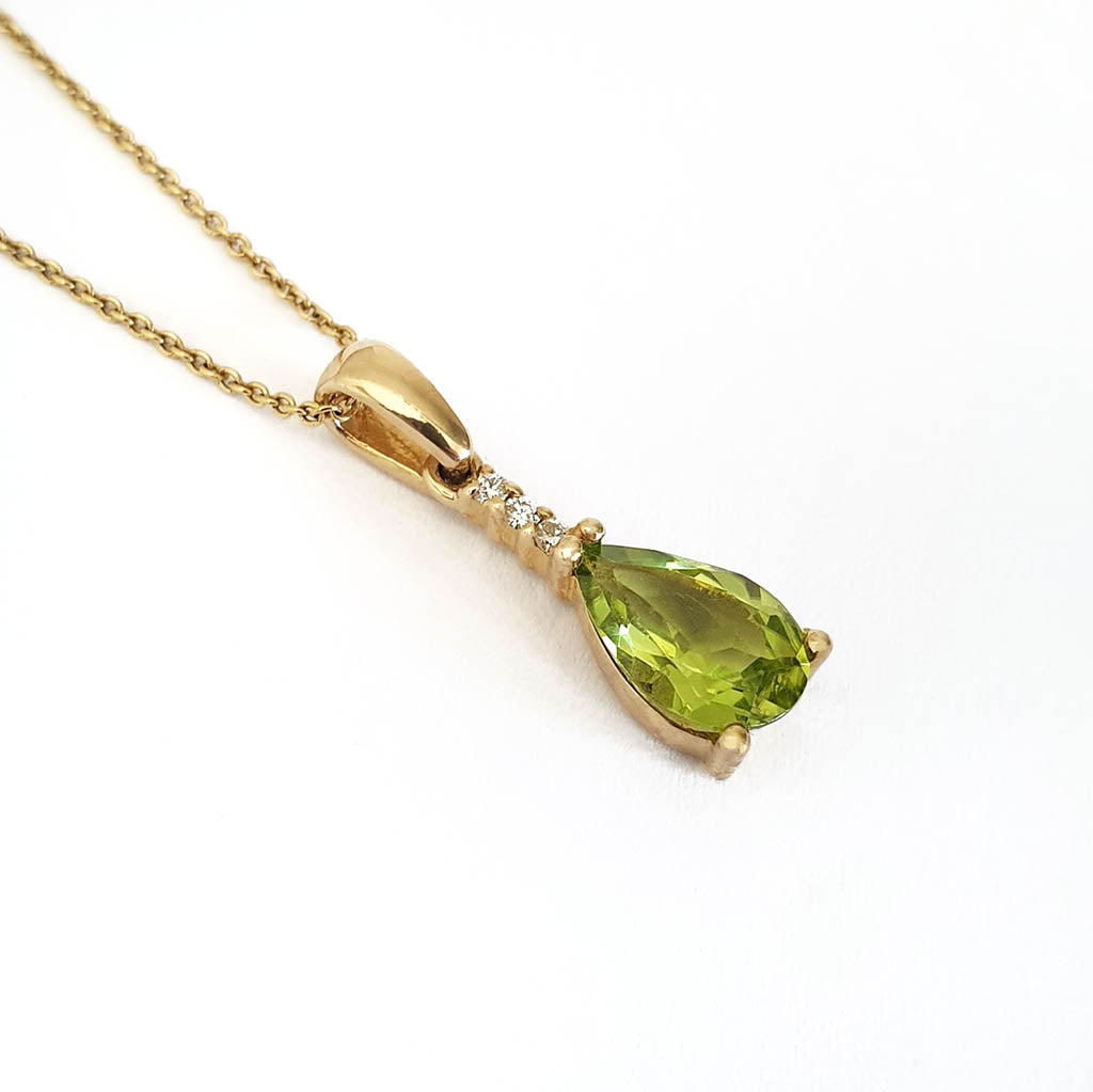 Pear Cut Peridot and Accent Diamond Drop Pendant