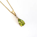 Pear Cut Peridot and Accent Diamond Drop Pendant