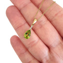 Pear Cut Peridot and Accent Diamond Drop Pendant