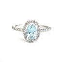 Petite Aquamarine Oval Cut Ring with Halo Diamond accents