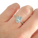 Petite Aquamarine Oval Cut Ring with Halo Diamond accents