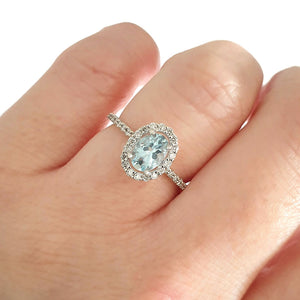 Petite Aquamarine Oval Cut Ring with Halo Diamond accents