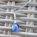 Handcrafted Oval Cut Tanzanite and Diamond Pendant