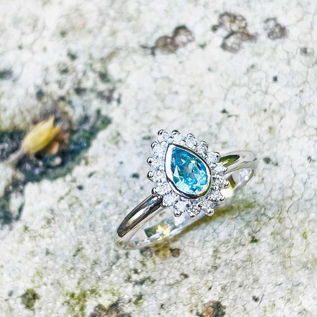 Radiant Pear Cut Blue Topaz with Diamond Halo Ring