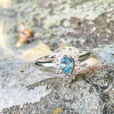 Radiant Pear Cut Blue Topaz with Diamond Halo Ring